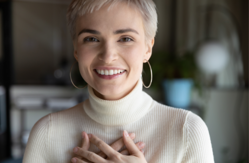 Woman with hands across chest